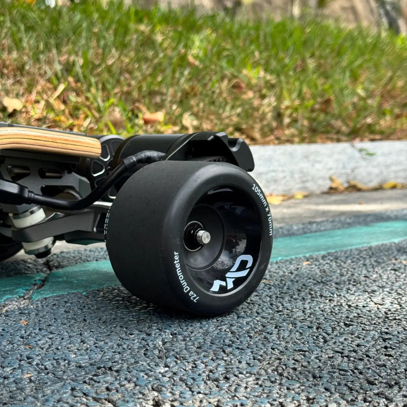 105mm Mad Wheels V2 electric skateboard wheels installed on board for real-world city commuting