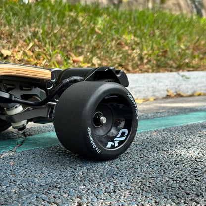 105mm Mad Wheels V2 electric skateboard wheels installed on board for real-world city commuting