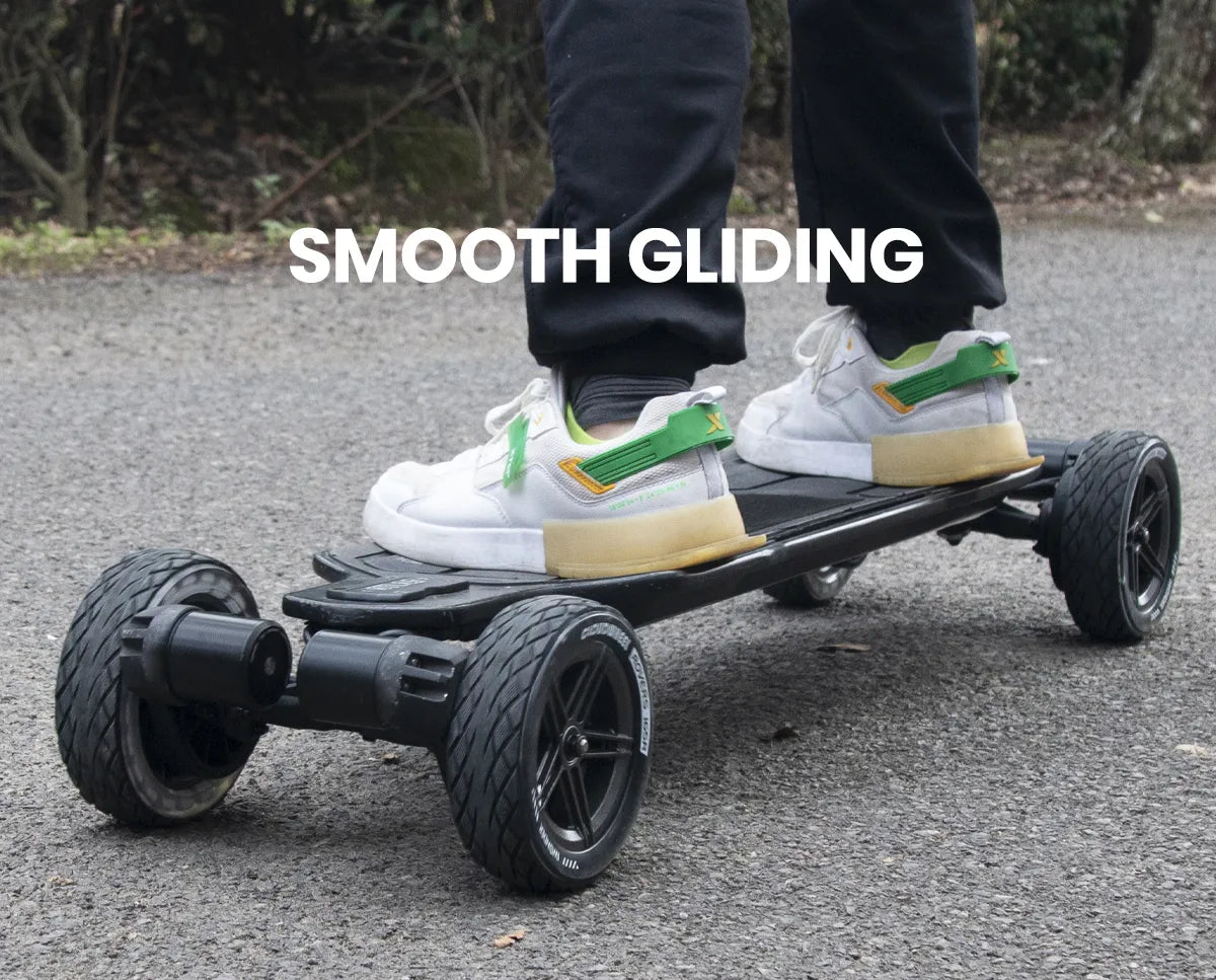 Rider using 165mm Cloudwheel Rover electric skateboard wheels for smooth gliding on paved road