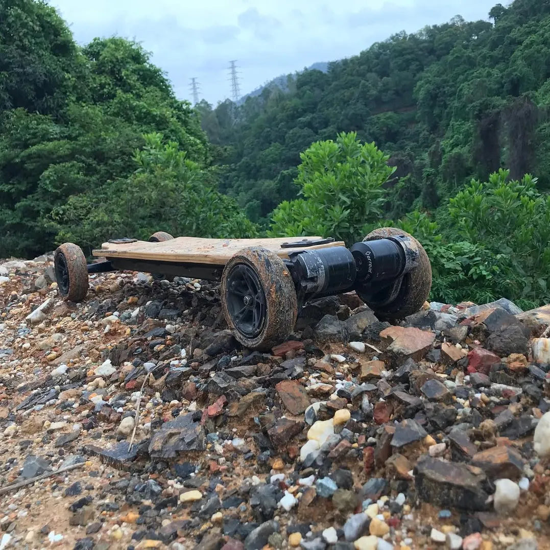Verreal RS electric skateboard with 150mm pneumatic wheels used off-road near a rocky cliff