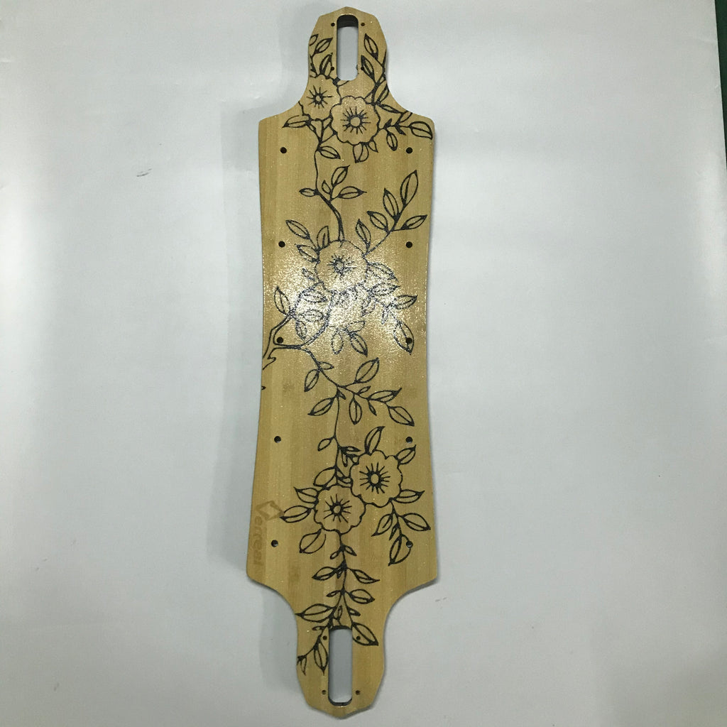 A beige Verreal RS skateboard deck with a floral pattern.
